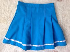 Vintage Pleated Mini Skirt | Tennis Skirt | 90s Mini Skirt | 80s Blue Mini Skirt | Sports Skirt | Activewear Skirt | Preppy Grunge Skirt |s | cheerleader skirt  1980s cheerleader sporty, bright blue mini skirt with a reflective stripe at the bottom.  Great condition, no noticeable flaws. Size: about an S/M Small / Medium US 2 - 6 or UK 6- 10 depending whether to wear it higher on the waist or lower at the hips. Measurements laid flat at the waist: 13.5 in. So waist would be 27 in. Max. PLEASE  N 90s Mini Skirt, Cheerleader Skirt, Skirt Tennis, Skirt Preppy, Grunge Skirt, Preppy Grunge, Sports Skirt, Blue Pleated Skirt, Pom Pom Girl