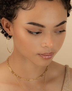 These delicate faux hoops are perfect if you don't have a piercing but want to rock the look. Faux hoops are sold individually and are easy and comfortable to wear. You will absolutely love the beauty and simplicity of these hoops! *Hand forged from high quality jeweler's wire *Customize your wire thickness (gauge) | choice of 22g and 20g *Customize your diameter size (mm) | choice of 5 to 10mm *Handmade using your choice of Sterling Silver, 14k Gold-Filled or 14K Rose Gold-Filled -------------- Fake Septum Ring, Faux Septum Ring, Fake Lip Ring, Faux Nose Ring, Faux Septum, Fake Nose Ring, Nose Ring Hoop, Gold Nose Ring, Hoop Earrings Large