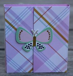 a close up of a card with a butterfly on it