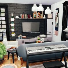 a living room filled with furniture and a flat screen tv mounted to a brick wall