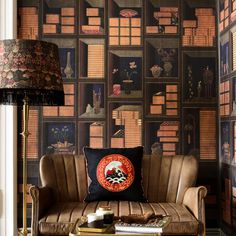 a living room with bookshelves on the wall and a couch in front of it