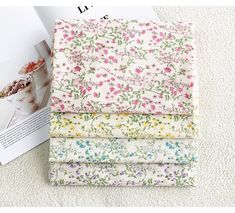 four pieces of fabric with flowers on them, one in white and the other in pink