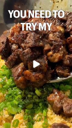 a bowl filled with rice and meat next to a spoon