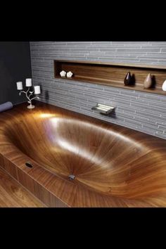 a large wooden bath tub in a bathroom