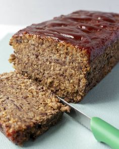 a close up of a piece of food with a knife