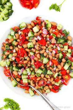 a white bowl filled with lots of veggies