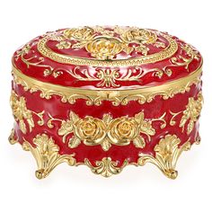 an ornate red and gold box on a white background