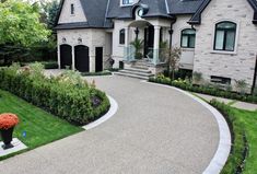 a driveway in front of a large house