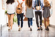 group of young people walking down the hall together stock photos, images and cliparts