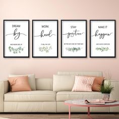 three framed art prints on the wall above a couch in a living room with pink walls