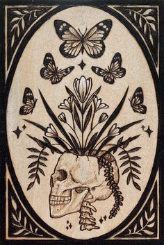 a tile with a skull and butterflies on it