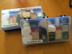 two plastic containers filled with toothbrushes on top of a wooden table