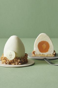 two plates with desserts on them, one has an egg and the other has crumbs