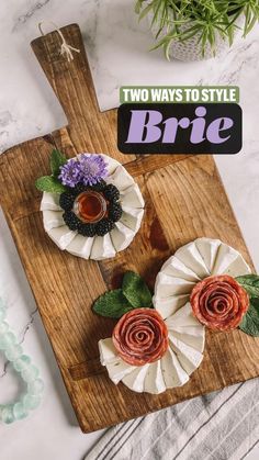 two flowers are sitting on top of a cutting board with the title two ways to style brie