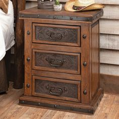 a wooden night stand with two drawers and a cowboy hat on it's top