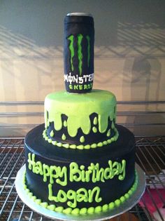 a birthday cake is decorated with neon green and black icing