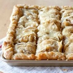 a close up of a pie on a table with a knife in it's hand