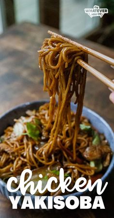 chicken yakisoba with chopsticks in a bowl on a wooden table