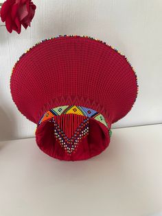 Zulu bucket hats with decorative beads. Available in various colours. Red Beaded Festival Hat, Traditional Multicolor Beaded Hat, Traditional Beaded Hats For Festivals, Traditional Beaded Festival Hats, Isicholo Zulu Hat, African Traditional Wedding Decoration, Lobola Decor, Masai Beadwork, Zulu Hat