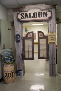 the entrance to saloon is decorated with wooden barrels