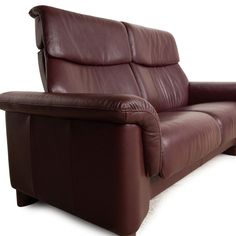 a brown leather reclining chair on a white background with the seat up and arm down