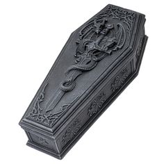 PRICES MAY VARY. Beautifully sculpted coffin box with a relief dragon sword sculpted on the lid of the keepsake box Made of high quality composite resin material and hand painted, the wall plaque measures 4" tall, 10" long and 4.5" wide and weighs around 2 lbs A beautiful dragon wrapping itself around a sword sits atop a gothic coffin lid, keeping a close guard over the treasures hidden within. Makes an enchanting addition to any home or office that makes use of Medieval and Gothic décor. This p Gothic Coffin, Medieval Decor, Gothic Dragon, Laser Cut Box, Nick Nacks, Coffin Box, Engraved Box, Clothing Art, Unique Storage