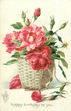 a birthday card with pink flowers in a basket