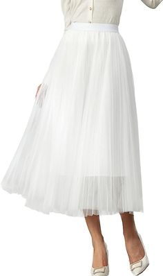 Look your best in the Prestigious Tulle Pleated Flowy Maxi Skirt. This lightweight and comfortable skirt is crafted from soft tulle that is pleated for maximum comfort. Its flowy skirt design adds a touch of class and elegance to your wardrobe. Perfect for formal occasions or everyday wear. 100% Polyester Imported Elegant pleated design: This pleated skirt features a beautiful pleated design that creates a flowing, elegant silhouette. The pleats are evenly spaced and give the skirt a luxurious t Elegant Tulle Lined Maxi Skirt, Elegant Tulle Flared Maxi Skirt, Elegant Flared Tulle Maxi Skirt, Elegant Tulle Midi Skirt, Elegant Midi Tulle Skirt, Pleated Tulle Party Bottoms, Pleated Tulle Party Skirt With Lining, Elegant Skirted Tulle Bottoms, Party Tulle Pleated Flared Skirt