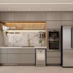 a modern kitchen with marble counter tops and stainless steel appliances