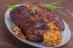 a large piece of meat sitting on top of a white plate