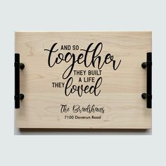 a wooden plaque that says and so together they built the loved