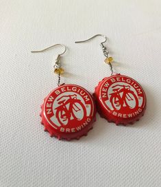 "Show off your love for craft beer with these New Belgium Brewing \"beerings.\" Accented with a glass topaz bead. Earrings measure 1.5 inches long from stainless steel earwire. A lightweight, summer favorite. Perfect for your Best friend, Girlfriend, Birthday" Beer Cap Jewelry, Bottle Cap Jewelry, Bottle Cap Earrings, Art Bottle, Cap Art, Beer Cap, Bottle Cap Art, Beer Caps, Friend Girlfriend