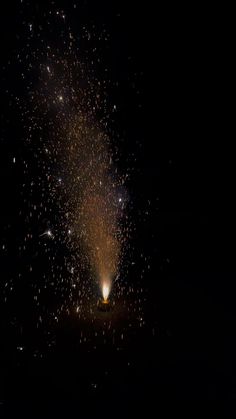 fireworks are lit up in the dark night sky with no one around them or on the ground