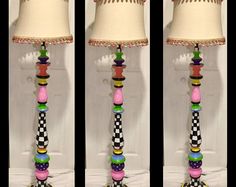 three different views of a lamp with colorful beads on it