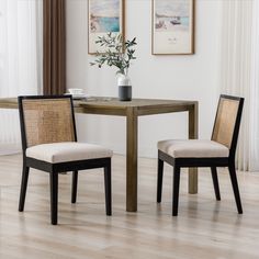 two chairs and a table in a room