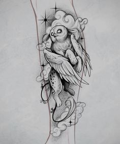 an owl and fish tattoo on the arm