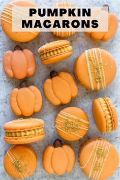 pumpkin macarons with white icing and chocolate chips on top, in front of the words pumpkin macaroons