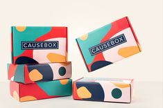 three boxes are stacked on top of each other, one has a box with the word causebox printed on it