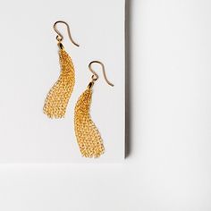 Delicate 14K gold-fill & vermeil fringe lightweight tassel earrings. 2" in length Gold Dangle Tassel Earrings With Fringe, Gold Metal Tassel Earrings With Fringe, Elegant Brass Tassel Dangle Earrings, Elegant Gold Brass Tassel Earrings, Gold-tone Dangle Linear Earrings In Brass, Tassel Earrings, 14kt Gold, Tassels, Gold Filled