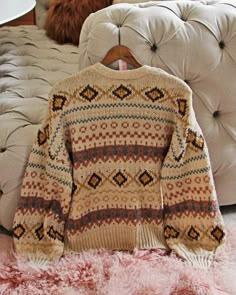 The softest thick & cozy knit pairs with Nordic & Fair Isle designs, a toggle button-up front, v-neck bust & oversized fit. Color: Sand & multi Acrylic blend Imported Hand wash cold Small Med Large Bust 44 46 48 Waist 44 46 48 Hips 44 46 48 Length 26 26 26 Bust, waist, and hip measurements are a total circumference. Length is measured from the top of the sweater to the hem. Measurements are an estimate. Big Cozy Sweaters, Sweaters For Winter, Vintage Knit Sweaters, Nordic Winter Outfits, Cabincore Fashion, Grandma Sweaters, Winter Sweaters For Women, Cozy Fall Sweaters, Cabin Sweater