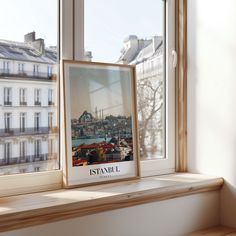 there is a picture frame on the window sill