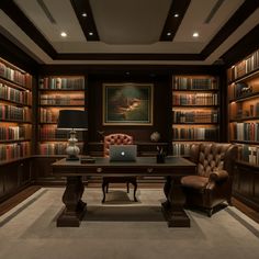 a home office with lots of bookshelves and leather chairs