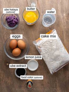 the ingredients for an egg cake laid out on a table