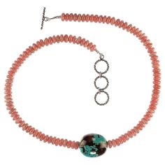 Delightful Springtime/Summertime necklace of rosey pinky/peachy rhodochrosite rondelles with a focal of highly polished turquoise in matrix. This 19 inch necklace is perfect for casual as well as dinner dance wear. Just put it on and enjoy the color and style. It features a three ring expandable Bali silver toggle clasp. Pink Topaz Necklace, Rhodochrosite Necklace, Amethyst Rock, Bamboo Coral, Bali Silver, Ruby Beads, Topaz Necklace, Gemstone Beaded Necklace, Modern Necklaces