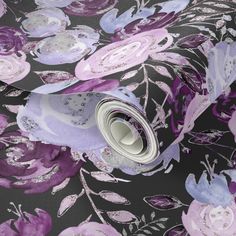 a purple and black floral print wallpaper with silver foil on the bottom half of it