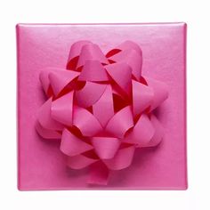 a pink gift box with a bow on it