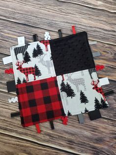 two pieces of fabric on top of each other with trees and deers in them