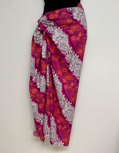 Lavalava. Perfect for sunny days on the beach, this sarong, or, ie lavalava, boasts a casual island style. Perfect for everyone, Silky quick-dry polyester fabric. Machine Wash Dimensions ﻿72" x 36" Bohemian Batik Print Sarong For Festival, Pink Tropical Sarong For Beach, Hawaiian Printed Sarong For Beach Cover-up, Hawaiian Printed Sarong For Beach Party, Hawaiian Style Printed Sarong For Beach Party, Multicolor Wrap Sarong For The Beach, Multicolor Wrap Sarong For Beach, Bohemian Patterned Sarong For Summer, Patterned Batik Print Sarong For The Beach