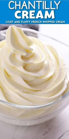 a bowl filled with whipped cream on top of a table