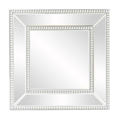 a square mirror with beaded trim around the edges